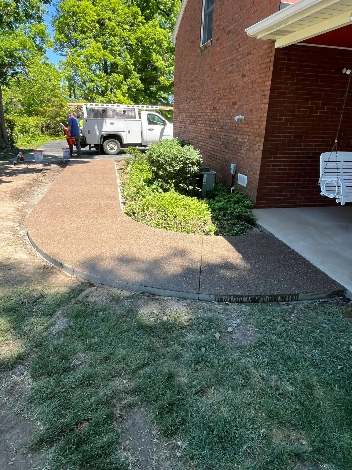 Curved exposed aggregate sidewalk
